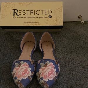 Multi colored floral flats.